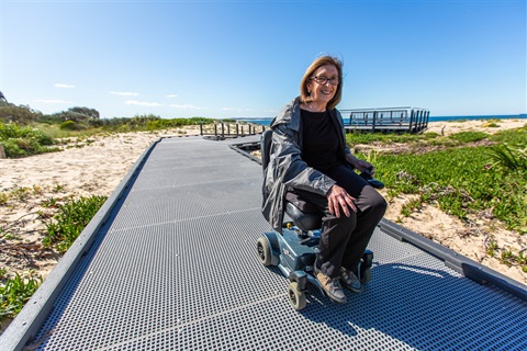 Wheelchair user Angela Barry at Blacksmiths Beach (1).jpg